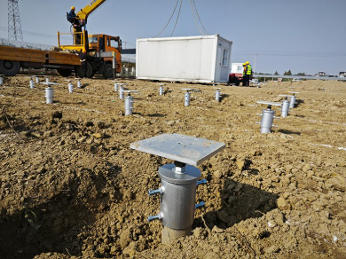 Field of installed helical pile caps
